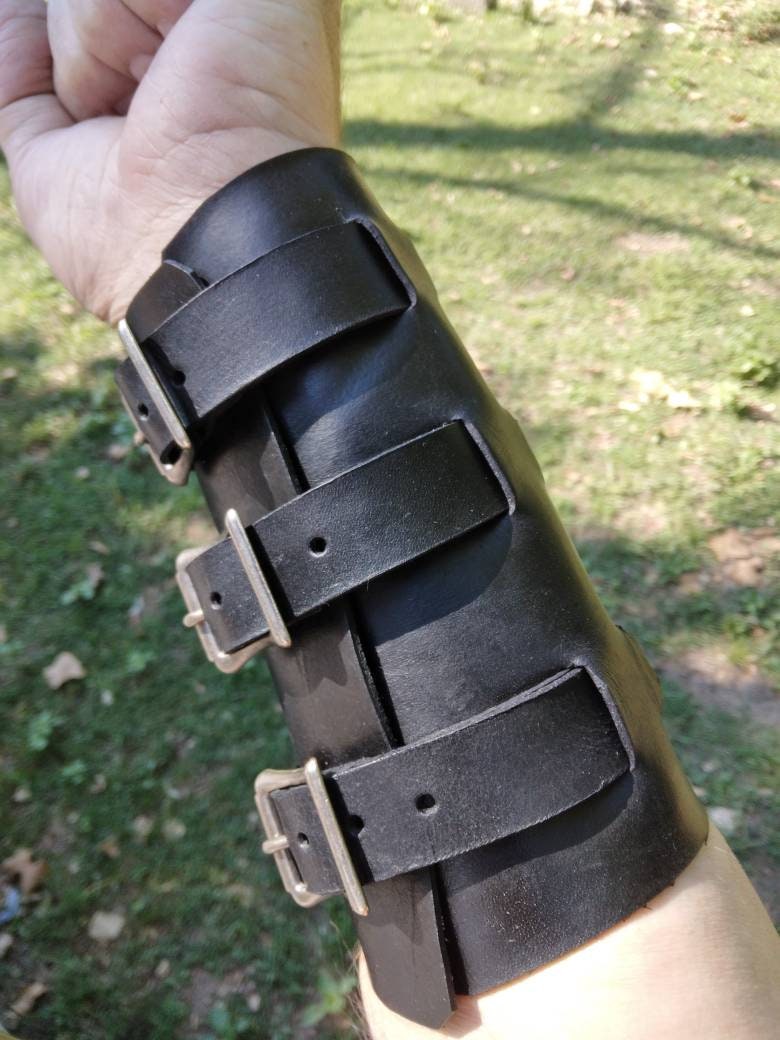 Handmade Leather Bracer Wrist Cuff Blacksmith Style Wristband with Pocket. 6" wide 7 1/2" long at the wrist diameter with three 3/4" buckle bands.