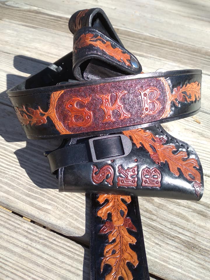 Handmade for left hand use. Freehand engraved and monogrammed, pistol holster for auto-loader or revolver.