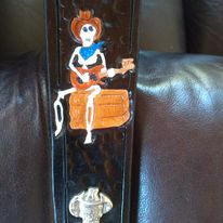 The Ultimate, padded, any width, any length and engraved leather guitar / bass strap.