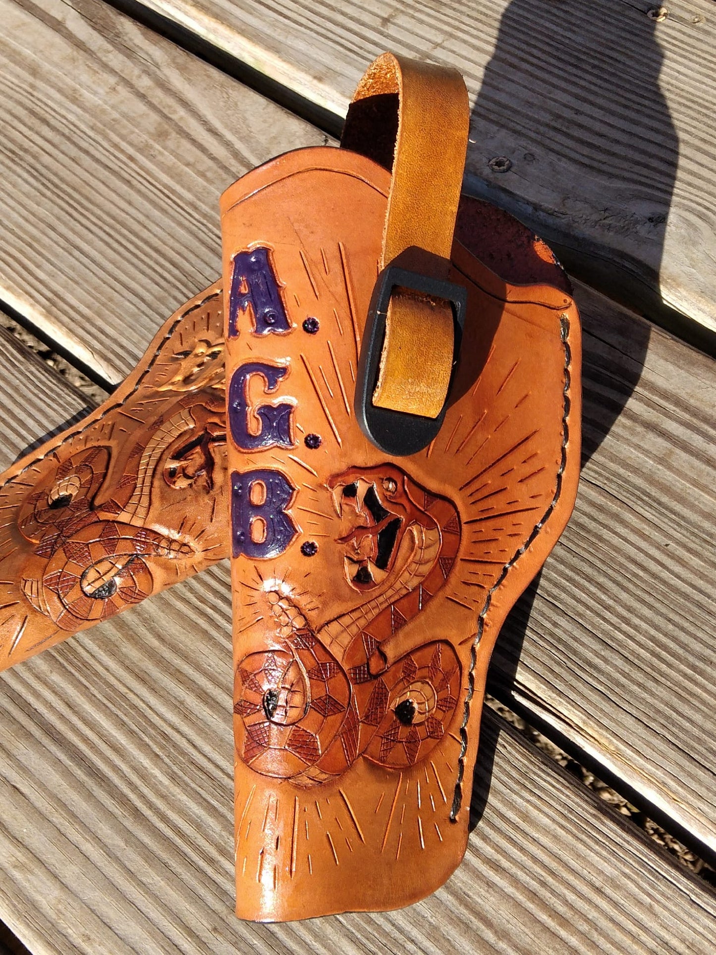 Handmade for left hand use. Freehand engraved and monogrammed, pistol holster for auto-loader or revolver.