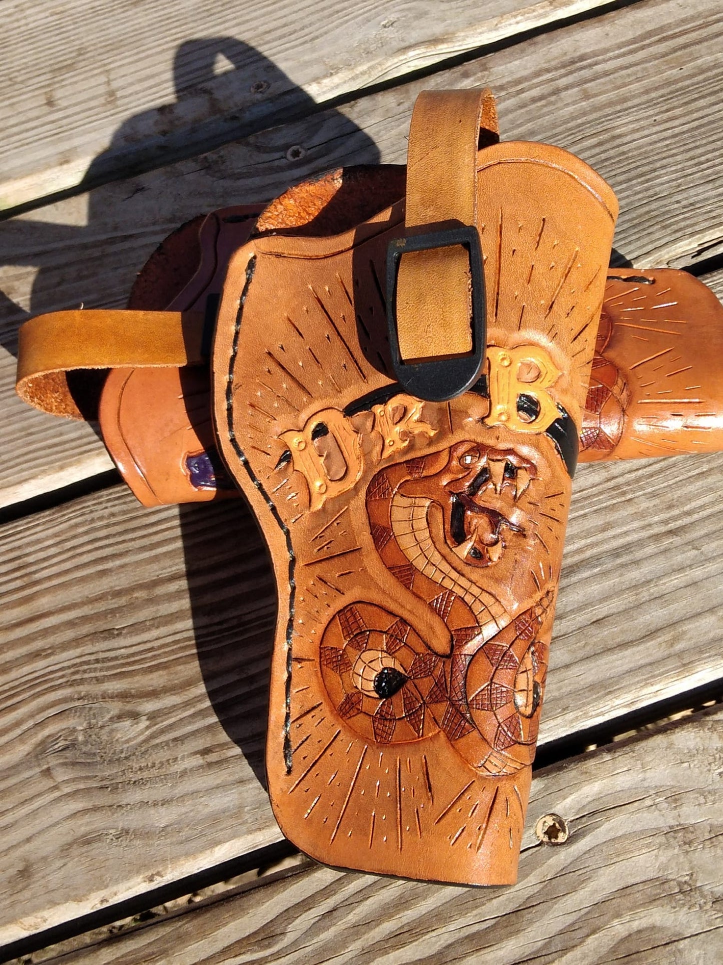 Handmade for left hand use. Freehand engraved and monogrammed, pistol holster for auto-loader or revolver.