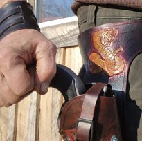 Handmade for left hand use. Freehand engraved and monogrammed, pistol holster for auto-loader or revolver.