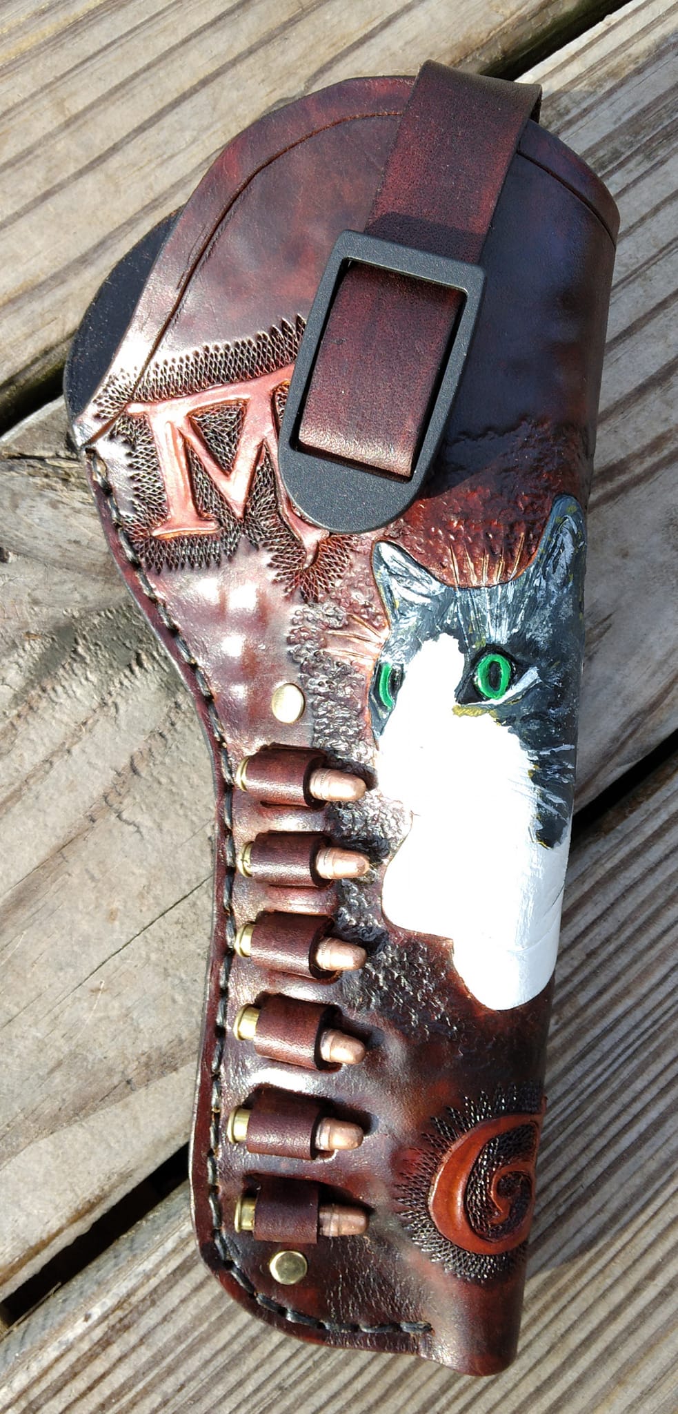 hand made holster for revolver or automatic hand gun with your choice of art engraved and painted.