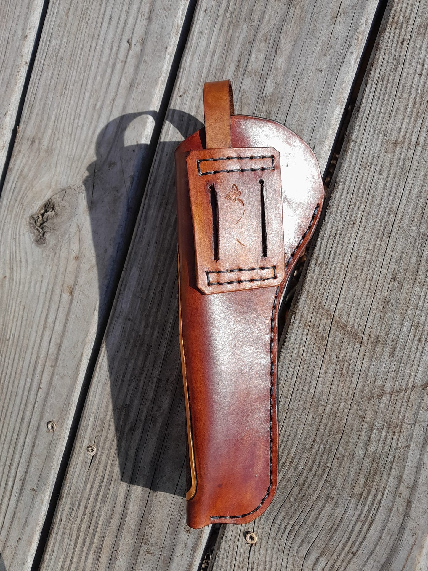 Handmade for left hand use. Freehand engraved and monogrammed, pistol holster for auto-loader or revolver.