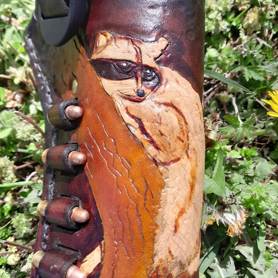 hand made holster for revolver or automatic hand gun with your choice of art engraved and painted.