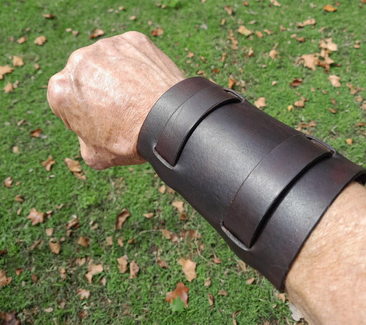 Handmade Leather Bracer Wrist Cuff Blacksmith Style Wristband. 5" wide 7 1/2" long at the wrist diameter with two 3/4" buckle bands. The Rumblefish.