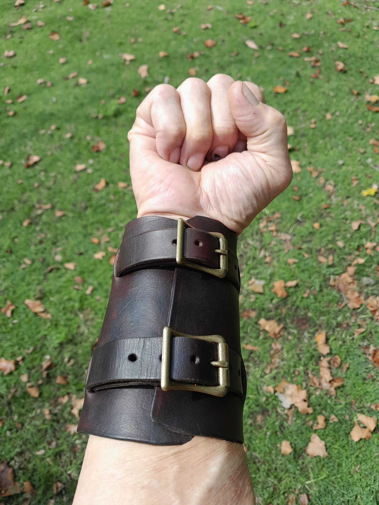 Handmade Leather Bracer Wrist Cuff Blacksmith Style Wristband. 5" wide 7 1/2" long at the wrist diameter with two 3/4" buckle bands. The Rumblefish.