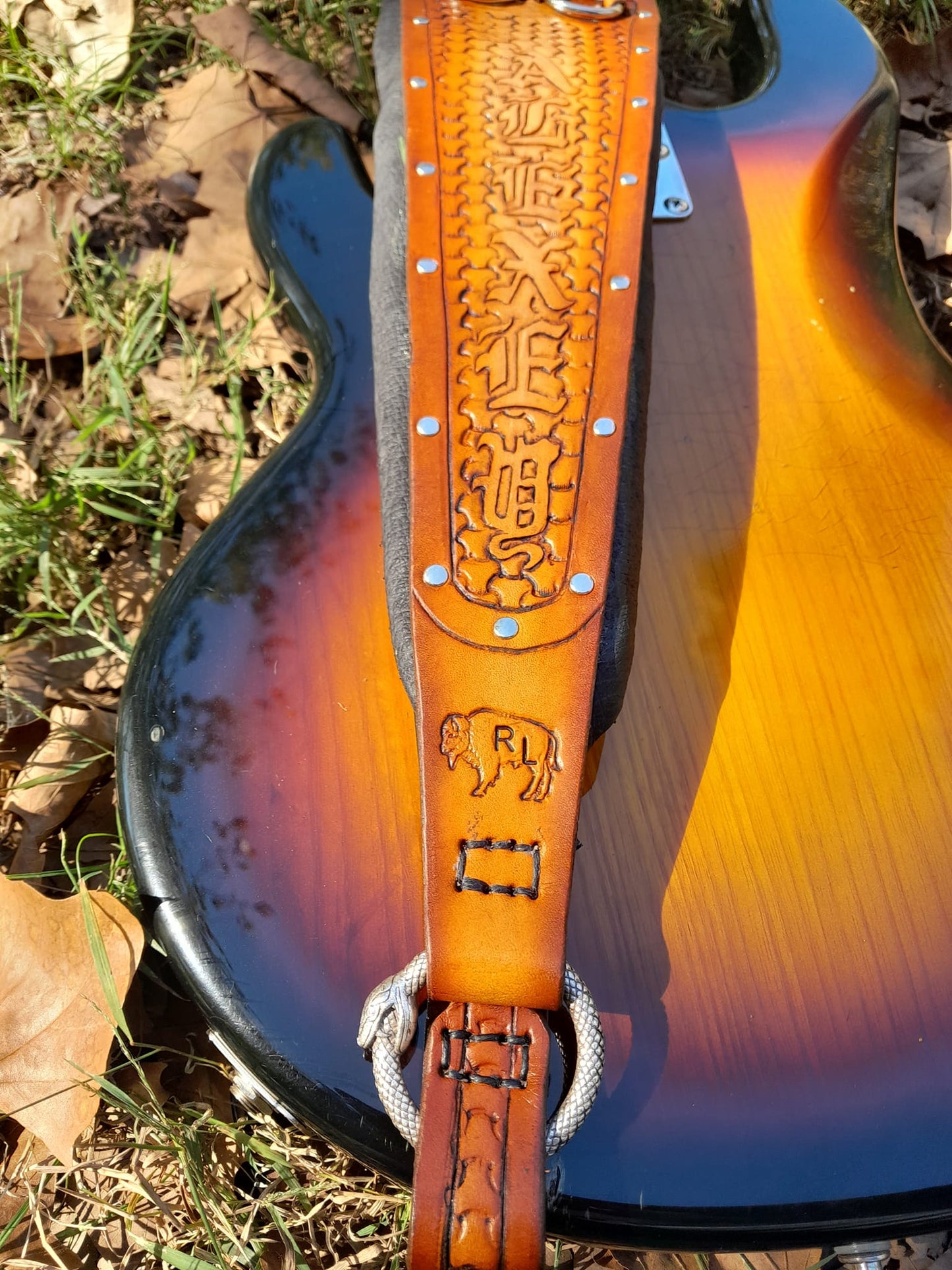 The Ultimate, padded, any width, any length and engraved leather guitar / bass strap.