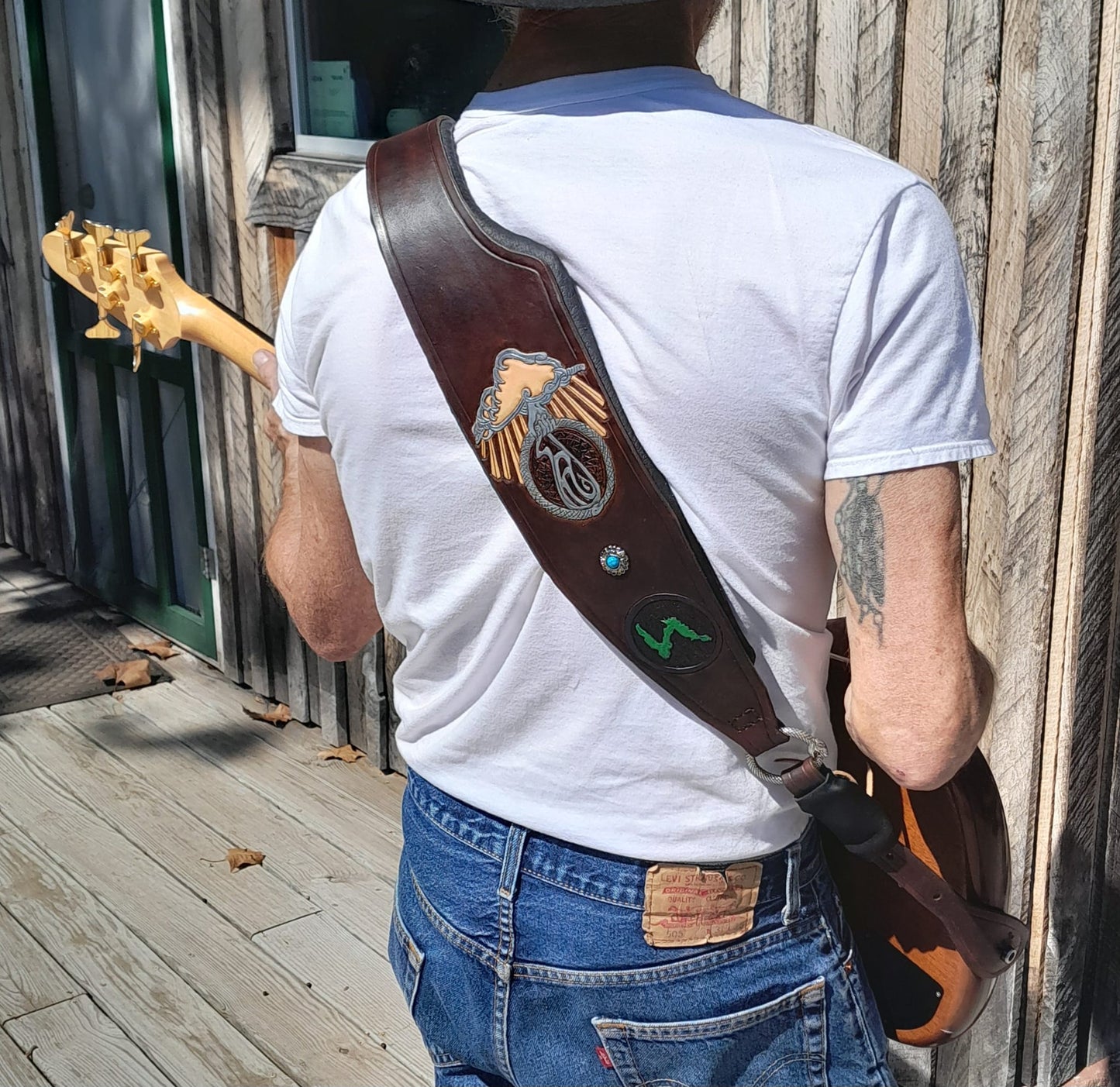 The Ultimate, padded, any width, any length and engraved leather guitar / bass strap.