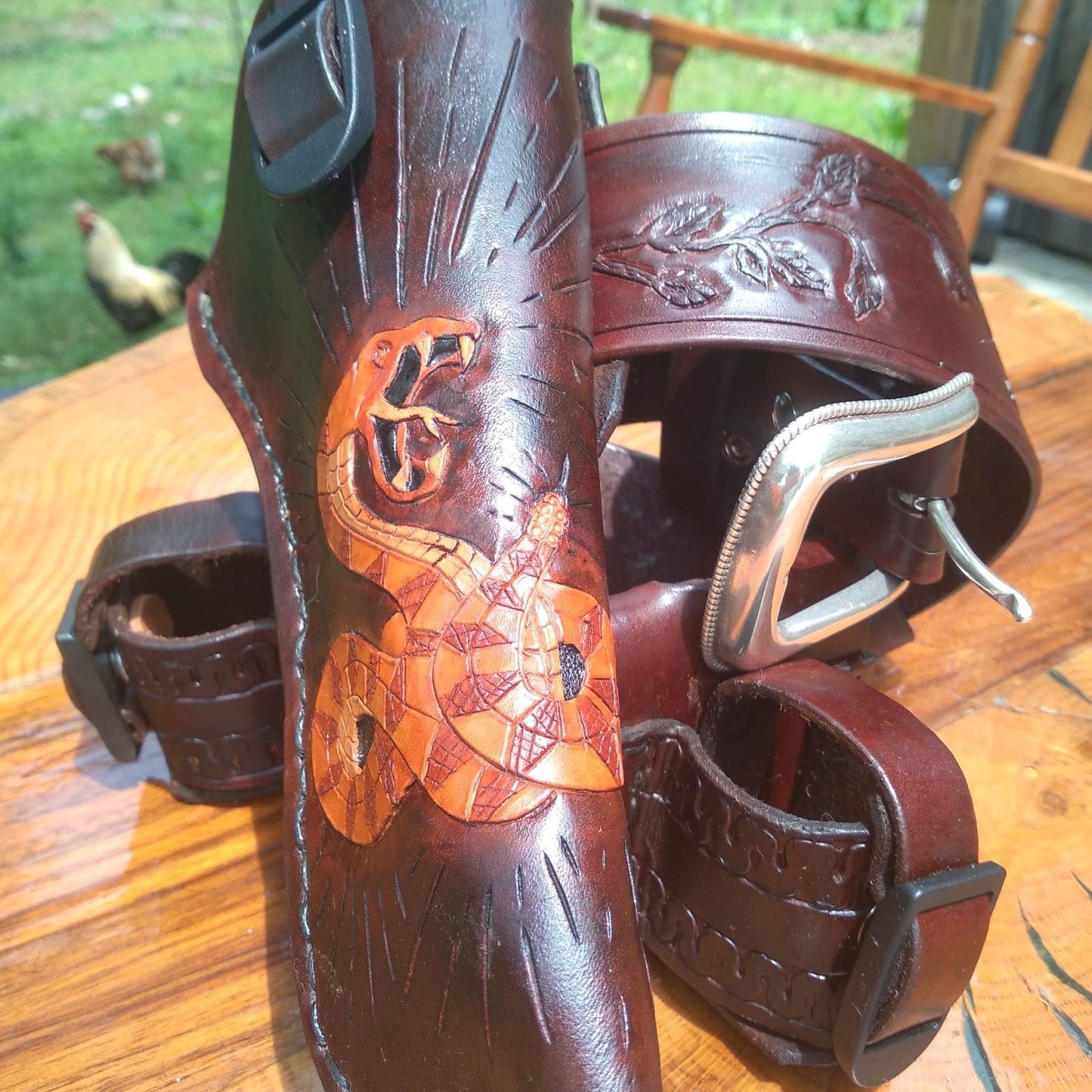 Handmade for left hand use. Freehand engraved and monogrammed, pistol holster for auto-loader or revolver.