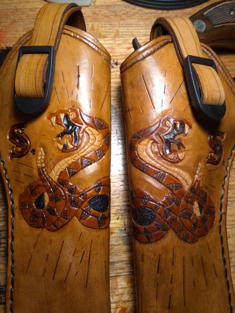 Handmade for left hand use. Freehand engraved and monogrammed, pistol holster for auto-loader or revolver.