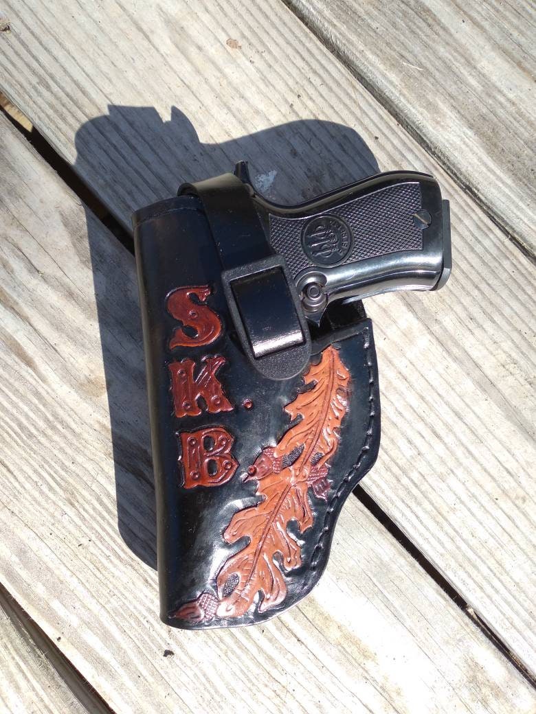 Handmade for right hand use. Freehand engraved and monogrammed, pistol holster for auto-loader or revolver with belt loop mount