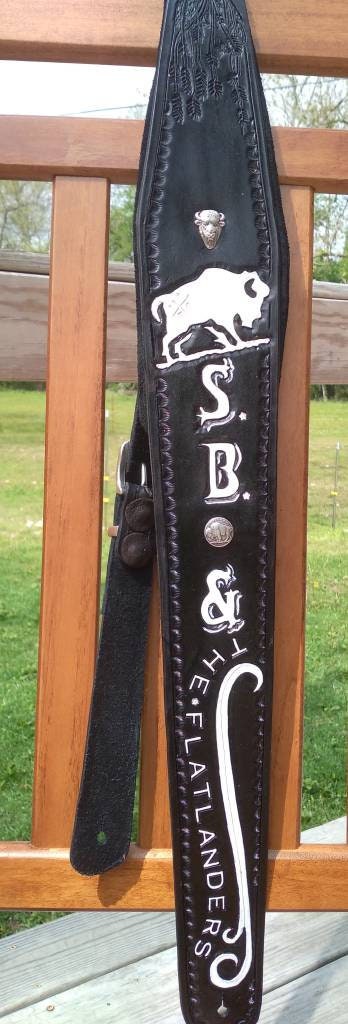 The Ultimate, padded, any width, any length and engraved leather guitar / bass strap.