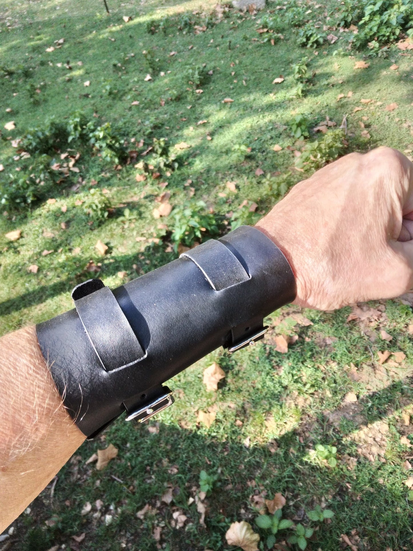 Handmade Leather Bracer Wrist Cuff Blacksmith Style Wristband. 5" wide 7 1/2" long at the wrist diameter with two 3/4" buckle bands. The Rumblefish.