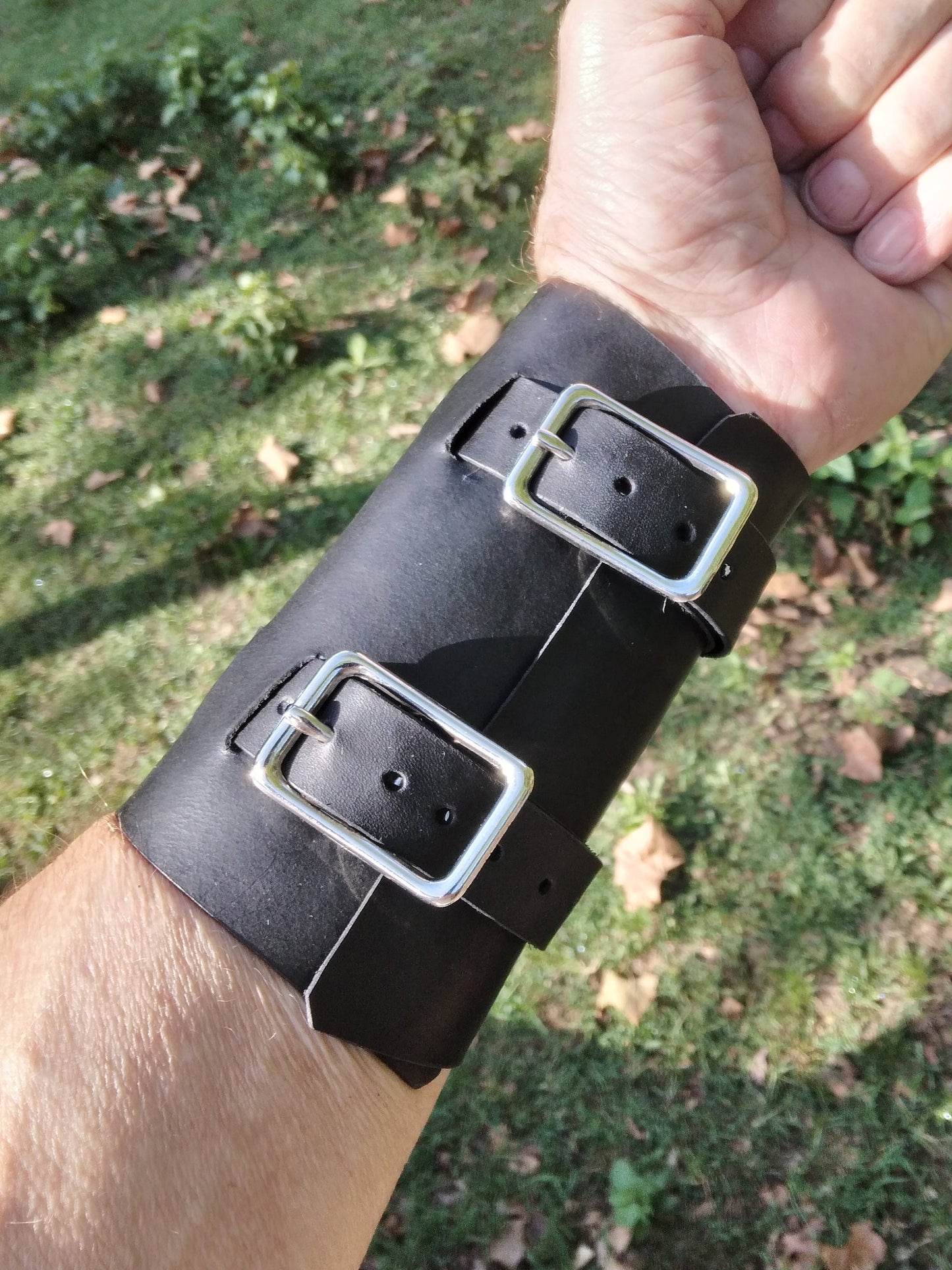 Handmade Leather Bracer Wrist Cuff Blacksmith Style Wristband. 5" wide 7 1/2" long at the wrist diameter with two 3/4" buckle bands. The Rumblefish.